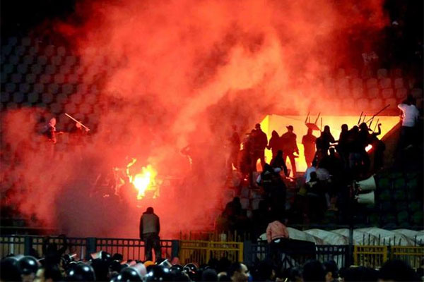 Port Said Stadium riot occured when rival fans attacked El Ahly players and their fans with bottles, stones, knives and fireworks.